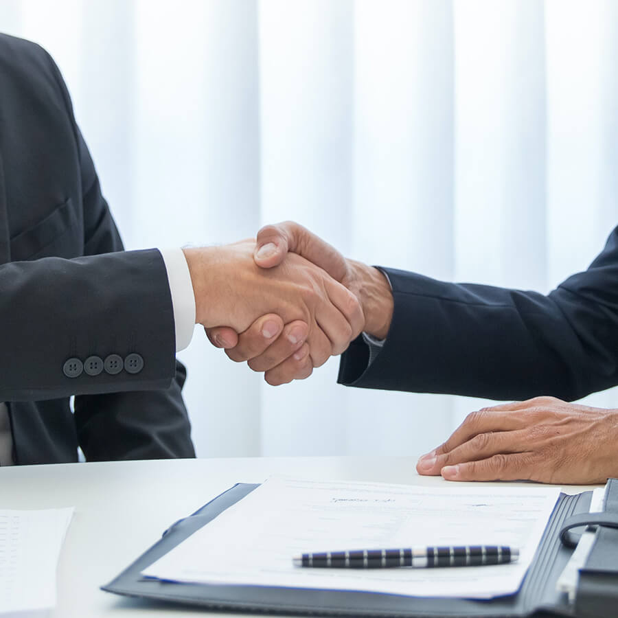fusies en overnames Handen schudden bij een overname